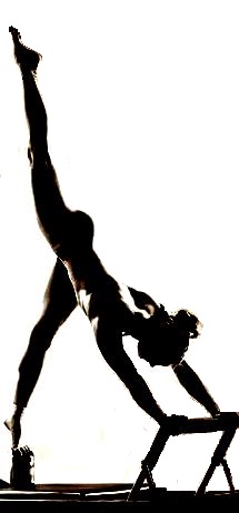 a woman performing an arabesque exercise on Pilates Reformer