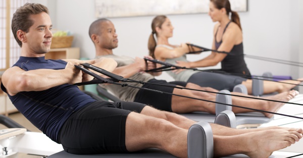 group class on a Pilates Reformer